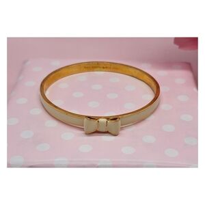 Kate Spade Cream Enamel Bow Hinged Bangle Bracelet with Gold Trim